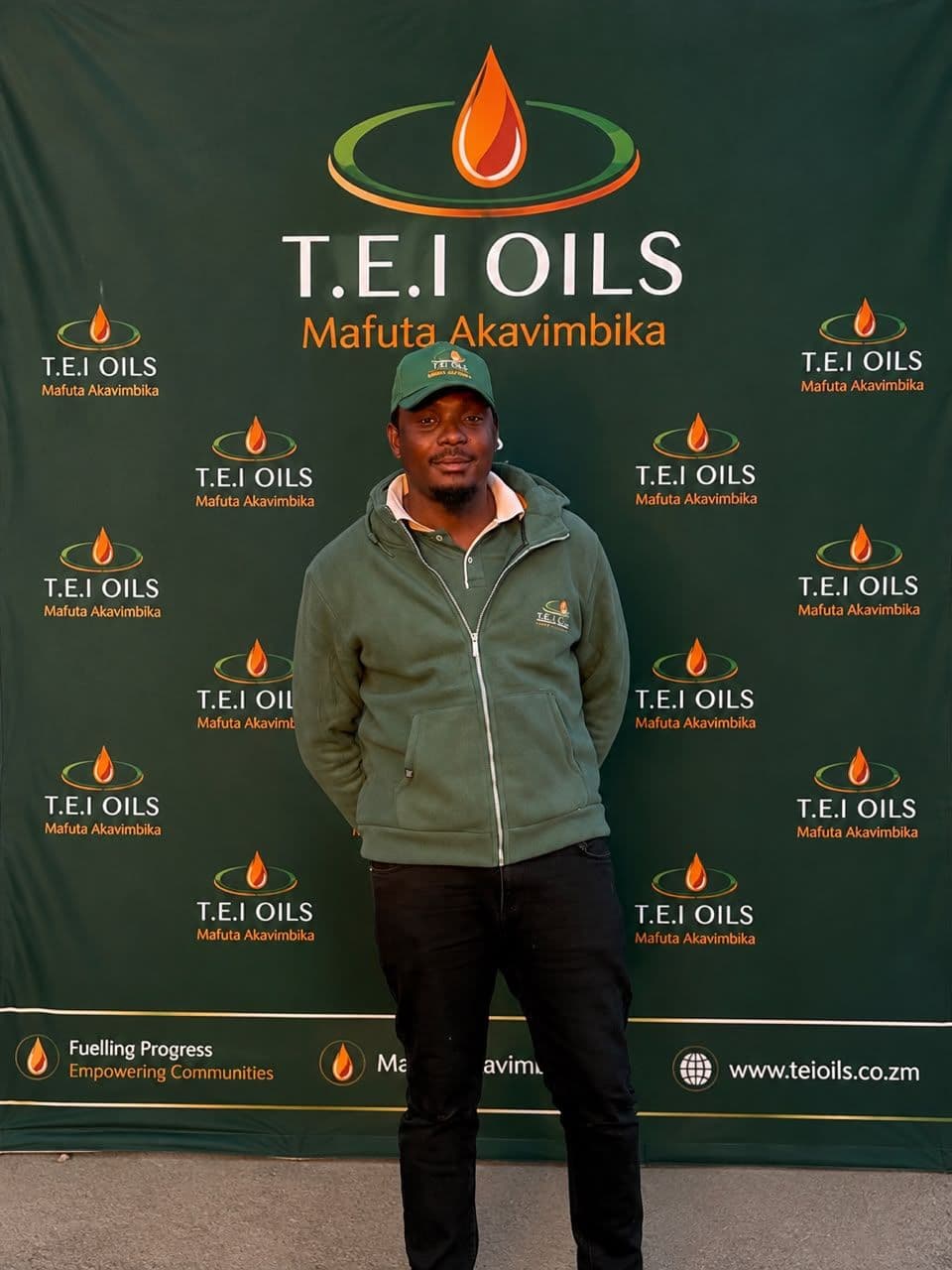 T.E.I Oils team member wearing a black cap